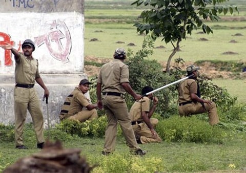 <b>Danger zone:</b> Policemen take position during an encounter with Maoist rebels at Bhimpur. (AP)