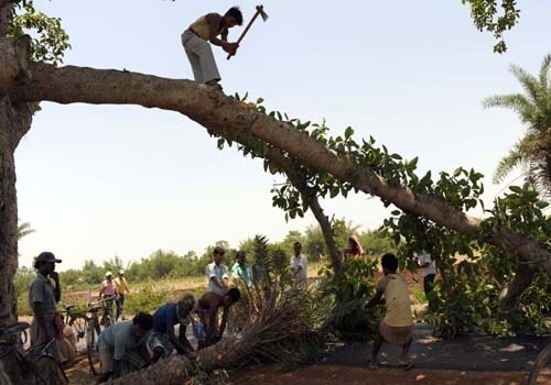 Soldiers carry mortar launchers as they move inside the villages of Lalgarh in the Midnapore district. (AFP)