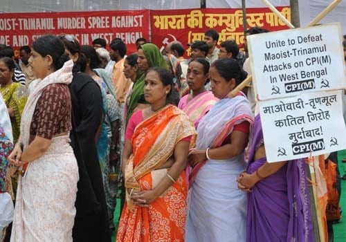 <b>As we plead for peace:</b> Activists of the Communist Party of India-Marxist (CPM) pray for their cadres killed by alleged Maoists in the West Midnapore 

district in West Bengal, during a protest in New Delhi. 

The protestors called on the government to immediately send paramilitary forces to the area to stop clashes between tribal villagers and police.(AFP)