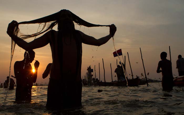 Participants at the Kumbh believe a bath in the river on one of the festival's auspicious bathing days can rid them of their sins. In this January 27 photo, a devotee takes the holy bath.