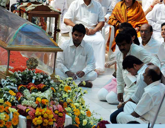 Sachin, an ardent devotee of Baba, was seen wiping his tears with a handkerchief handed over by his wife. (AFP Photo)