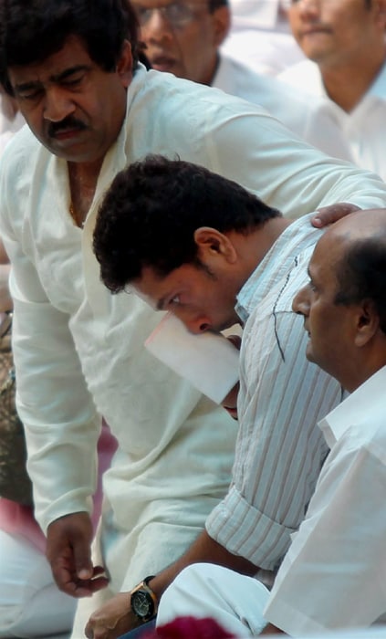 Sachin Tendulkar gets emotional while paying his last respects to the body of Sri Sathya Sai Baba in Puttaparthi, Andhra Pradesh on Monday. (PTI Photo)