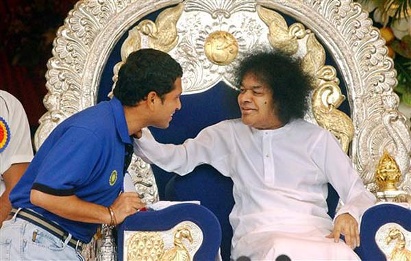 Indian cricketer Sachin Tendulkar, left, greets Indian godman Sai Baba during his 80th birthday celebrations, at Puttaparthy, in the southern Indian state of Andhra Pradesh, Wednesday, Nov. 23, 2005.