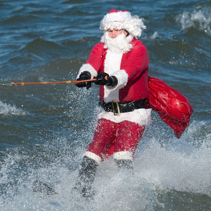 Santa Claus water skis down the Potomac River on Christmas Eve December 24, 2010, at Maryland's National Harbor, a few miles down the river from Washington, DC. The Water Skiing Santa, Flying Elves, a Jet-Skiing Grinch, and even Frosty the Snowman, have been appearing on the river for 25 years in freezing temperatures. What started as a small thing has now turned into an annual event with thousands of people watching from the shore. (Photo courtesy: AFP)