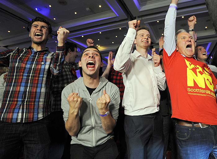 Pro-union supporters celebrate as Scottish independence referendum results come in at a 'Better Together' event in Glasgow, Scotland, on September 19, 2014.