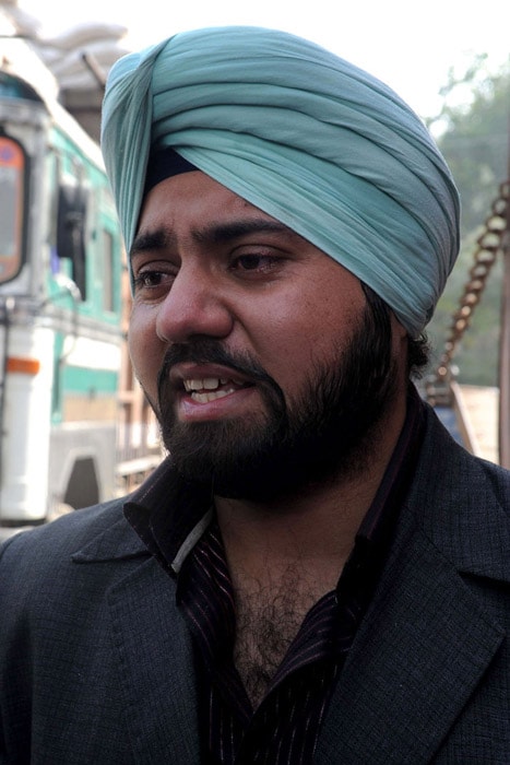 Taranjit Singh, relative of beheaded Sikh, Jaspal Singh speaks to the media on his way back to Pakistan after the news of the killing of Jaspal by Taliban in Pakistan's restive Orkazai agency, at the India-Pakistan Wagah Border on Monday. (AFP Photo)