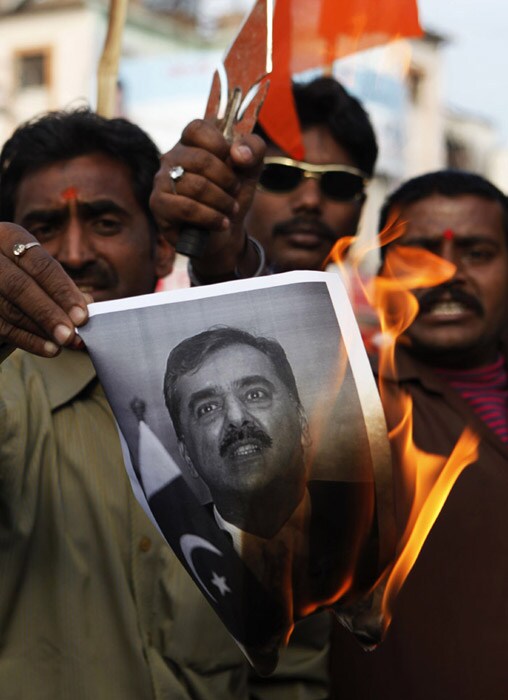 Allahabad also saw protests on Monday. Here, we see Indian activists burn a photograph of Pakistan Prime Minister Yousuf Raza Gilani. The protest took place after the decapitated bodies of two Sikhs were found almost a month after they were kidnapped in Pakistan's Khyber tribal region, officials said on Monday. (AP Photo)