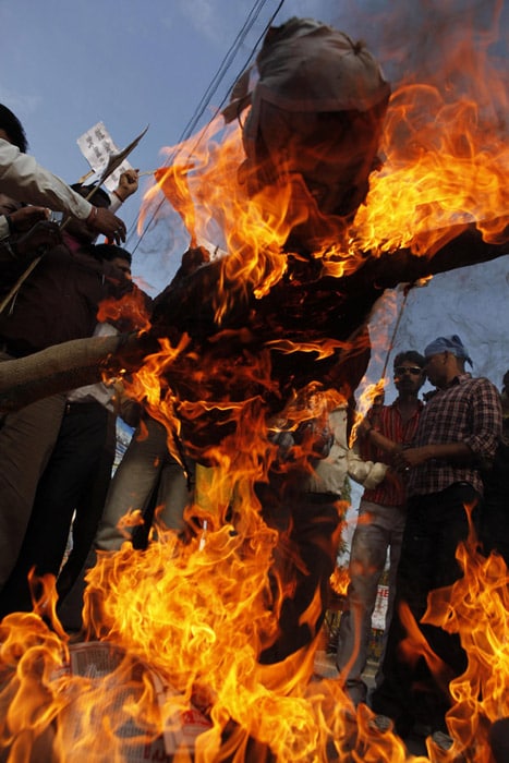 Indian activists burn an effigy of Pakistan President Asif Ali Zardari during a protest in Allahabad. (AP Photo)