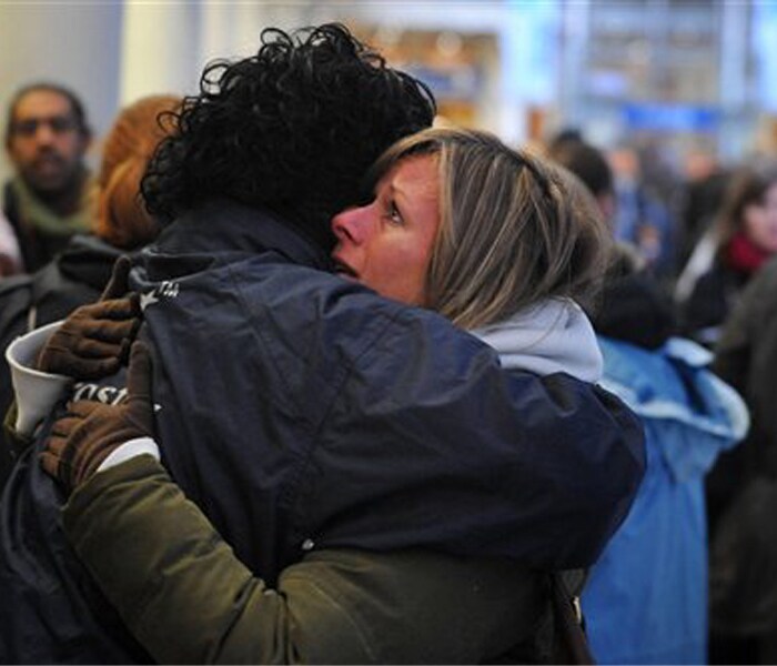 A member of Eurostar staff, left, comforts a passenger as she waits at St Pancras Station in London after delays to the Eurostar train services on Saturday.<br><br>The Eurostar train service between Britain and France was suspended Saturday morning after more than 2,000 passengers were stranded for hours after four passenger trains broke down in the Channel Tunnel.<br><br>Initial reports blamed the breakdowns on wintry weather conditions on both side of the English Channel.(AP photo)