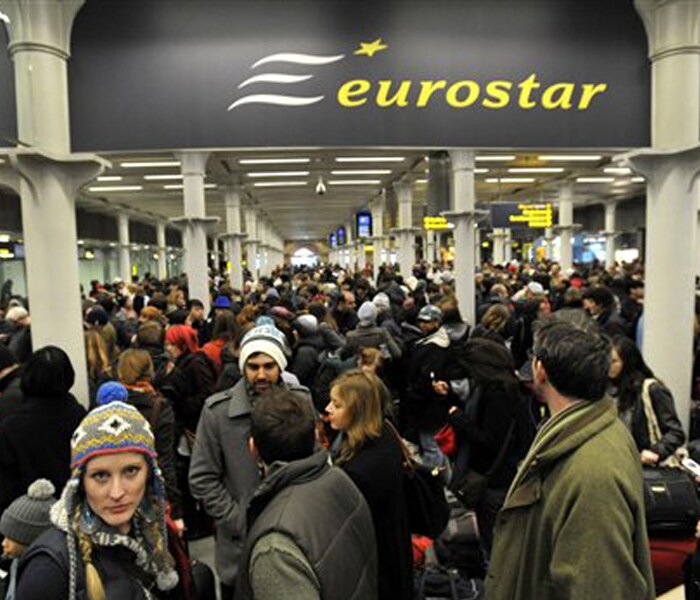 Passengers wait at St Pancras Station in London after delays to the Eurostar train services.<br><br>The Eurostar train service between Britain and France was suspended on Saturday morning.(AP photo)