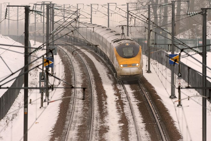 A Eurostar train travels enroute to St Pancras International station in London, through the snow-covered countryside near Maidstone in Kent, south east England on December 22, 2010. The race was on at snowbound European airports Wednesday to clear the backlog of stranded passengers in time for Christmas as weather conditions eased slightly. (Photo courtesy:AFP)