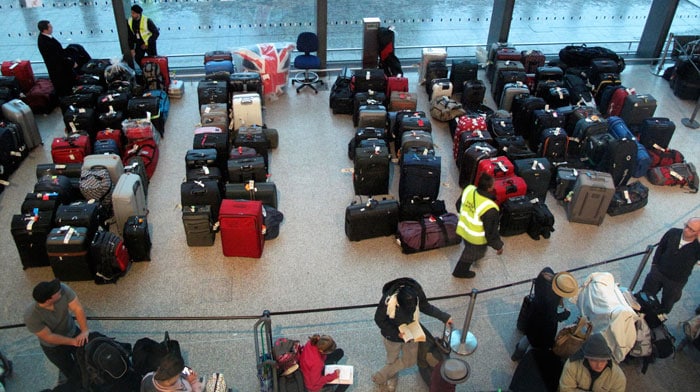 Airport officials placed two tents outside Terminal 3 to handle overflow passengers, but crowds were smaller and only one was used. Computer screens there showed 11 out of about 50 incoming flights had been canceled.