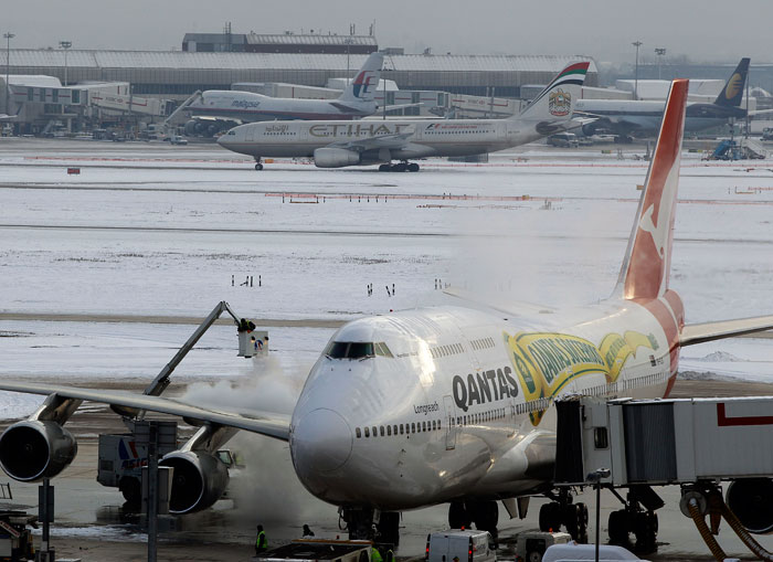 Temperatures have picked up in Britain and about 70 percent of Heathrow's planned departures -- some 900 flights -- are expected to operate Wednesday. Airlines are trying to clear a backlog of canceled flights, after iced-over runways and planes triggered days of chaos and misery for those seeking to travel elsewhere for Christmas. (Photo courtesy: AP)