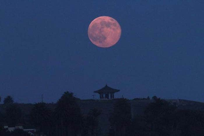 Supermoon rising over San Pedro's Korean Friendship Bell in the neighborhood of Los Angeles. Photo Courtesy - The Los Angeles Times