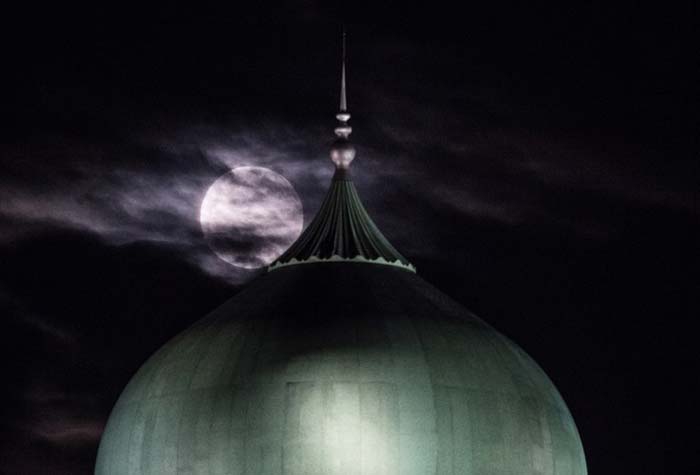 "Supermoon" is seen past the dome of the Prime Minister's Office complex in Putrajaya. (AFP Photo)