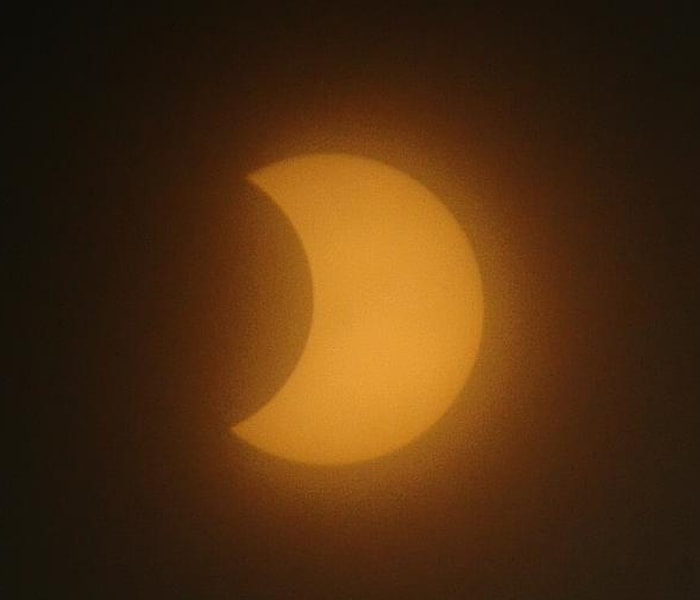 The longest annular solar eclipse of the century left people spellbound for about ten minutes at midday when the sun almost vanished from the sky. Hundreds gathered at the hot spots to view the spectacle. Through this photofeature we bring you photos sent by our surfers from across the country.<br><br>Amit Singh from Noida sends us this glorious picture of darkness at noon.<br><br><a href="http://www.ndtv.com/convergence/ndtv/new/india.aspx" class="fn fl">Send your solar eclipse photos here</a>