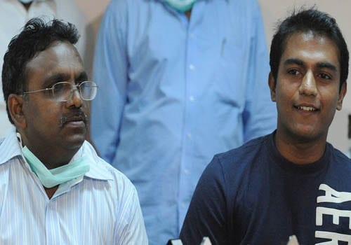 A patient, along with a doctor, addresses a press conference after being successfully treated for the H1N1 flu virus at the Government Chest Hospital in Hyderabad. (AFP)