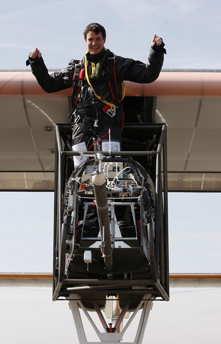 After a gentle landing, Test pilot Markus Scherdel emerged from the cockpit with his arms raised, and the team broke open bottles of champagne. (AP Image)