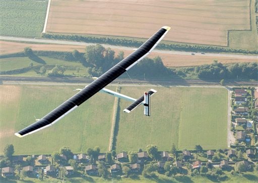 The Solar Impulse team members were cheering on Thursday as their experimental solar-powered plane completed its first 24-hour test flight successfully, proving that the aircraft can collect enough energy from the sun during the day to stay aloft all night.<br><br>The test brings the Swiss-led project one step closer to its goal of circling the globe using only energy from the sun.<br><br>But while the team says this proves that emissions-free air travel is possible, it doesn't see solar technology replacing conventional jet propulsion any time soon.<br><br>Instead, the project's overarching purpose is to test and promote new energy-efficient technologies. (AP Photo)