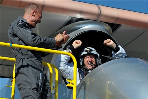 Borschberg, a 57-year-old former Swiss fighter endured freezing conditions during the night and ended the test flight with a picture-perfect landing to cheers and whoops from hundreds of supporters on the ground. (AP Photo)