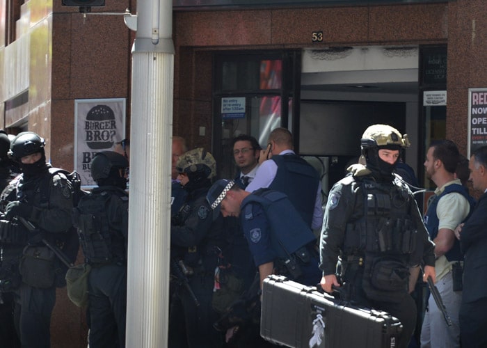 Hostages Held in Cafe in Sydney, Islamic Flag Held Up