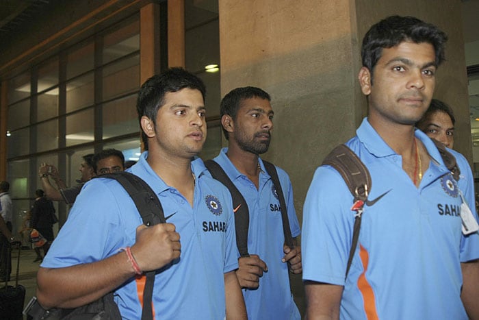 Suresh Raina with teammates Praveen Kumar and RP Singh as Indian team arrive at the OR Tambo international airport in Johannesburg. (AP Photo)