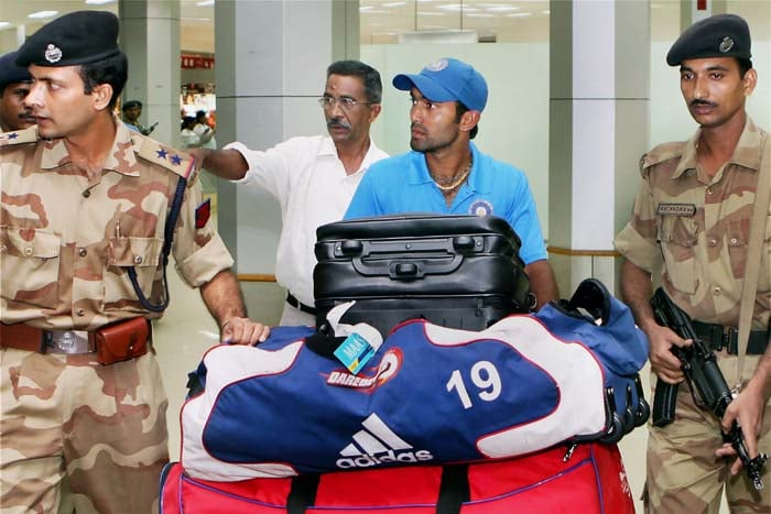 Dinesh Karthik arrives at Chennai Airport, after India won the Compaq Cup tri-series final in Sri Lanka on Monday. India beat Sri Lanka by 46 runs last night to clinch the four-match series, which also featured New Zealand. (PTI Photo)