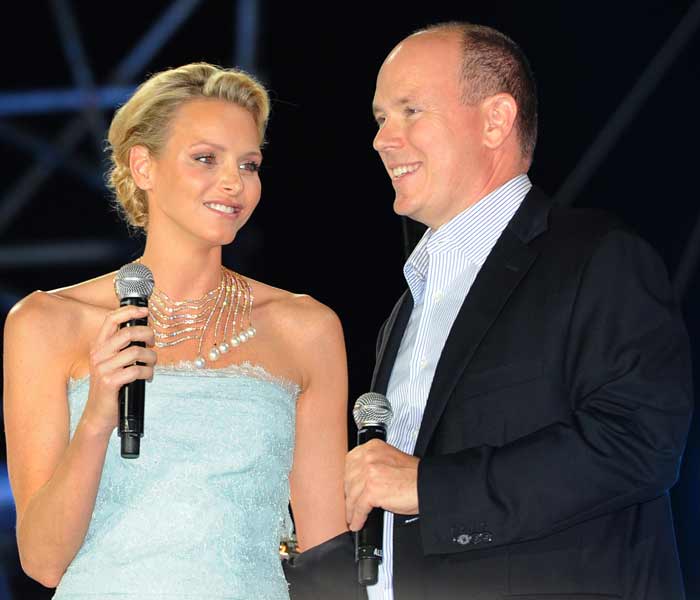 The ceremony on Friday was followed by a sound and light show at Port Hercule. <br><br> In this pic, Prince Albert II of Monaco and his wife Princess Charlene stand on stage prior to French artist Jean-Michel Jarre's sound and light show at Port Hercule.(AFP photo)