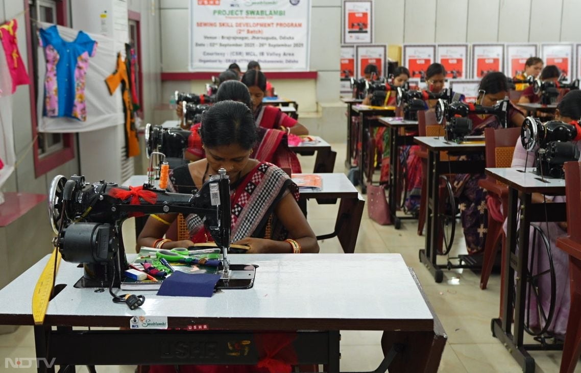 In Odisha's Jharsuguda district, tribal women from Lamptibahal village gather at a Usha Silai School center partnered with Mahanadi Coalfields Limited and Gram Utthan, focused on sewing machines as they learn basic stitching under the Swablambi program. Amid the hum of threads and fabrics, participants like Rambati Saura transform from homemakers to entrepreneurs, mastering skills that boost orders, income up to ?10,000 monthly, and the ability to train others, fostering self-reliance in rural coal belt communities.