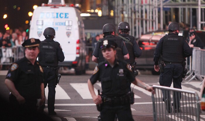 The officer, who did not give his name because he was not authorized to speak to the news media, said that a man was seen fleeing the SUV and that the police evacuated the area in case there were other threats nearby. (AFP Photo)