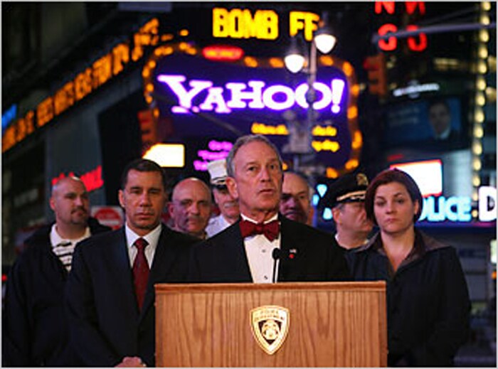 Mayor Michael R. Bloomberg, with Gov. David A. Paterson, spoke at a news conference in Times Square early Sunday. (NYT Photo)