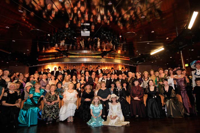 One century after Titanic's fatal end, more than 1,700 passengers on two cruise ships, the MS Balmoral from Southampton and the Azamara Journey from New York City, will meet at the site where the Titanic went down to witness a partial reenactment. <br/> Passengers in costumes pose for a group picture following a reception at the MS Balmoral Titanic memorial cruise ship, in the Atlantic Ocean. <br/> (AP Photo)