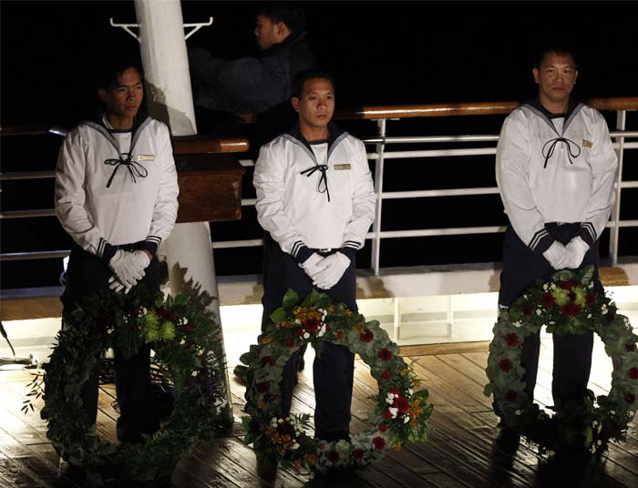 Cruise ship passengers and crew said prayers on Sunday at the spot in the North Atlantic where the Titanic sank 100 years ago with the loss of more than 1,500 lives. <br/> (AP Photo)