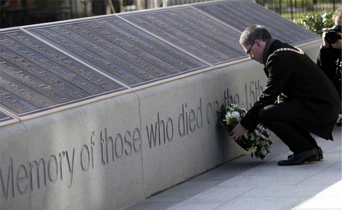 Belfast spent decades scarred by its link to the disaster, but has come to take pride in the feats of engineering and industry involved in building the Titanic. In this picture, Belfst Lord Mayor Niall � Donnghaile lays a wreath at the Titanic Memorial Plaque during the service at Belfast City Hall, Northern Ireland on Sunday. <br/> (AP Photo)