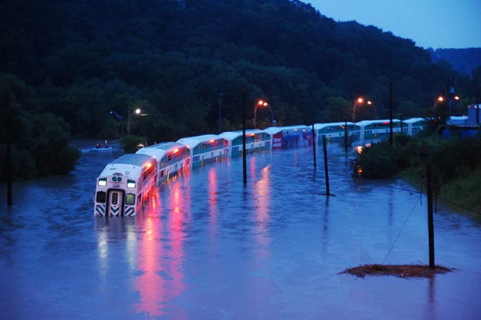 Seen here, a GO Train is stranded on flooded tracks in Toronto. The thunderstorm forced the shutdown of city's subways, cut power to 300,000 in Canada's largest city and caused Porter Airlines to cancel all flights out of the downtown