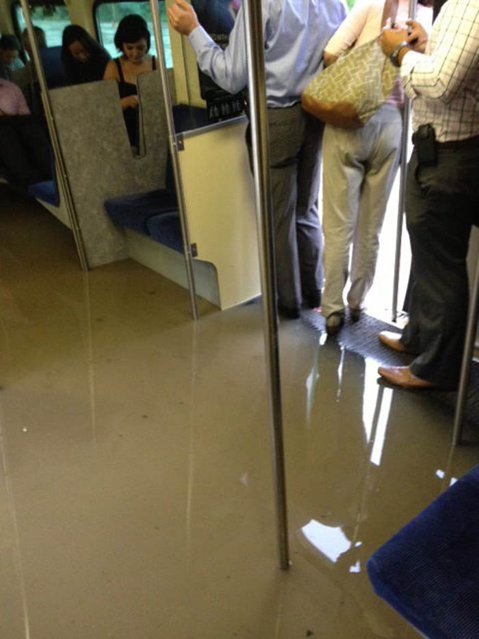 All of Toronto's subway service was temporarily halted due to power and signal issues. Some stations were also flooded.<br></br>
In this photo provided by Michael Li of The Canadian Press, water rises in a GO Train stranded on flooded tracks in Toronto.