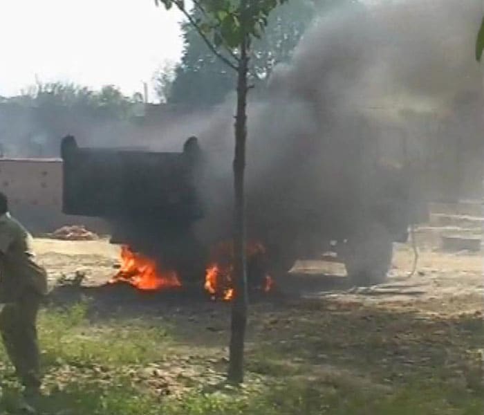 An angry mob set fire to a truck on Tuesday after it crushed a small child in the Makdoompur area of Gomti Nagar in Lucknow, Uttar Pradesh. (NDTV Photo)