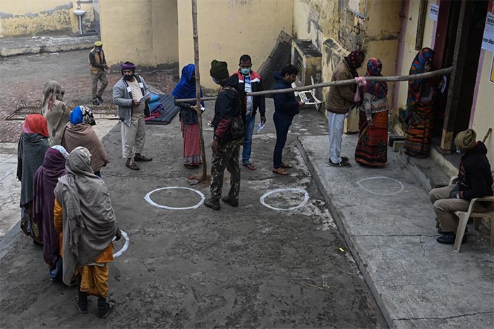 UP Election 2022: Voters queue up to cast their ballot at a polling station in Vrindavan during the first phase of Uttar Pradesh state assembly elections.