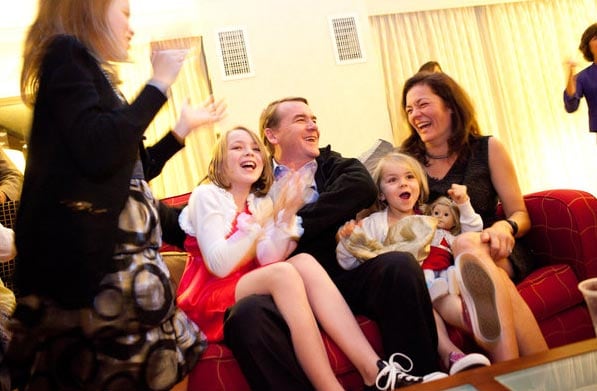 Senator Michael Bennett, his wife, Susan Daggett, and their children reacted to seeing early results showing him in the lead in the Colorado Senate race against Ken Buck. (NYT Photo)