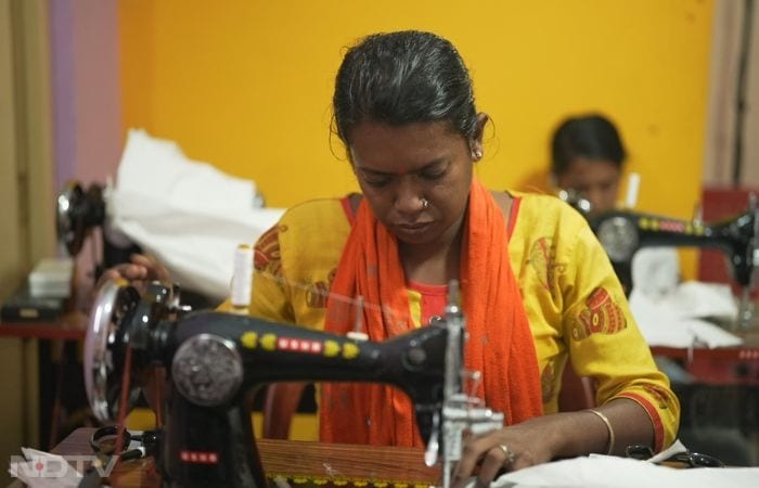 In a bright training room in West Bengal, transgender participants sit attentively at Usha sewing machines under the NIRDPR-CIRDAP Action Lab for Inclusive Livelihoods, guided by a skilled Usha instructor. Amid colorful fabric rolls and pattern charts, they practice precise stitches on apparel pieces, embodying the program's focus on skill-building for economic dignity and social inclusion, with PLEQSUS India Foundation ensuring a supportive environment that breaks barriers and fosters self-employment for marginalized communities.