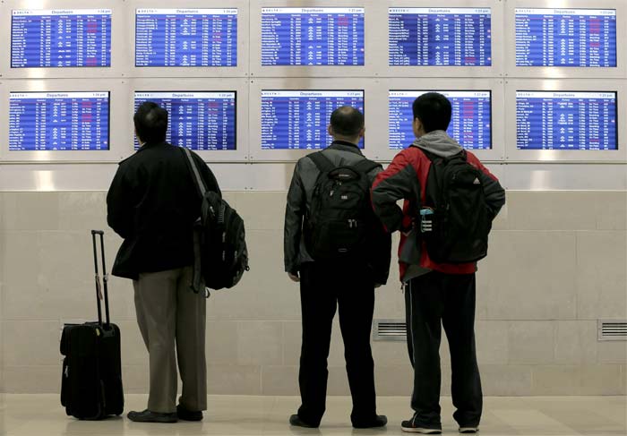 The mix of rain and snow, which covered buildings, roads and cars in parts of New York, New Jersey, Connecticut, Pennsylvania and Massachusetts, also led airlines to cancel flights for a day.