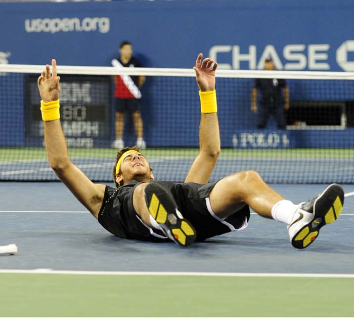 Tennis player Juan Martin Del Potro from Argentina celebrates after beating Roger Federer from Switzerland during the final of the 2009 US Open. (AFP Photo)<br />