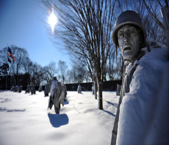 Snow blankets the 19 stainless steel statues of the Korean War Veterans Memorial on the National Mall, Washington.(AFP Photo)