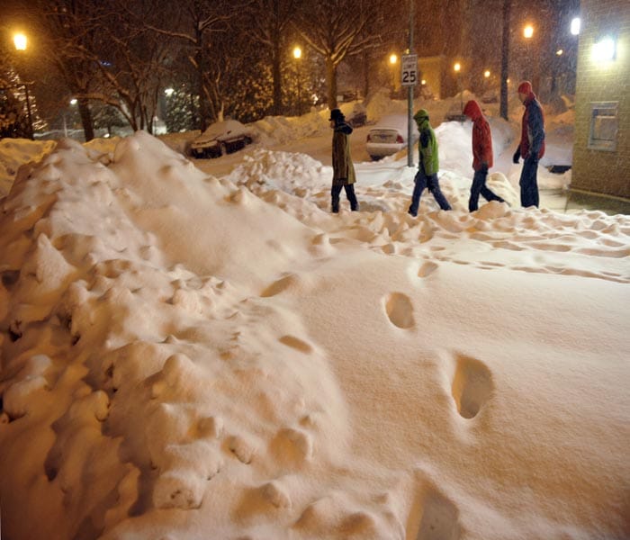 The storm affected rush hour traffic and commuters using public transport had to wait for over 20 minutes for their rides in Chicago.<br><br>About 80 schools across the area were closed for the day.(AFP Photo)