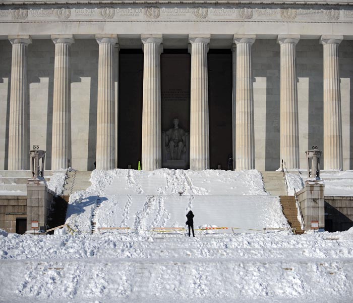 Visitors to the Lincoln Memorial were not allowed on the stairs or into the main chamber due to snow and ice.<br><br>The Federal Government was closed along with schools and many businesses.(AFP Photo)