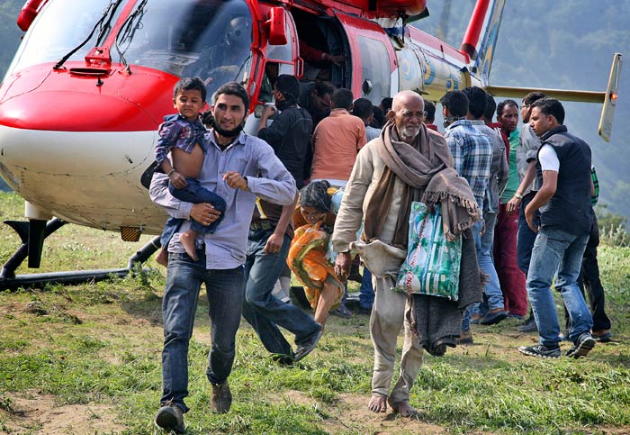 Seen here, a batch of pilgrims is brought to safety in Joshimath on June 21.<br><br>For more information, go to <a href="http://www.ndtv.com/sos" class="fbld fn fl ">www.ndtv.com/sos</a>