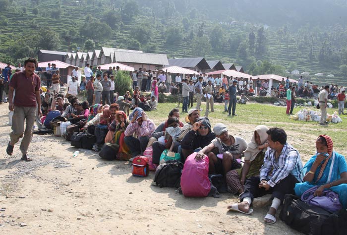 Pilgrims wait to be evacuated by helicopters in Gauri Kund.<br><br>For more information, go to <a href="http://www.ndtv.com/sos" class="fbld fn fl ">www.ndtv.com/sos</a>