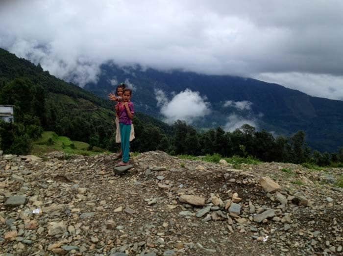 NH 109 to Kedarnath has been shut for two months now after big chunks of the highway have simply been washed away with the river and rain fury, beyond Chandrapuri. <Br><br> Seen here, two girls in Kedar Valley.<br><br>Photo courtesy: Ketki Angre