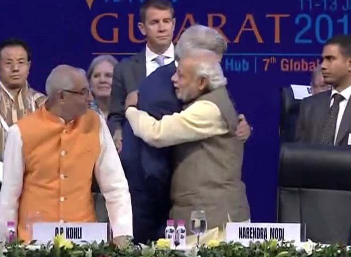 Prime Minister Narendra Modi welcomes US Secretary of State John Kerry at the Vibrant Gujarat Summit 2015.