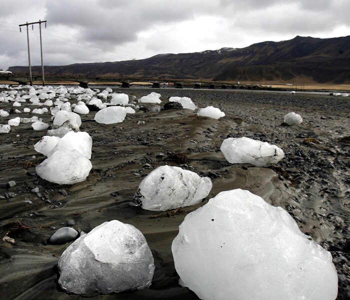 Ice chunks carried downstream by floodwaters caused by volcanic activity lie on the Markarfljot river bank, some 120km east of the capital Rejkavik, Iceland. The Eyjafjallajokull glacier volcano began erupting for the second time in a month, sending ash several miles (kilometers) into the air. Winds pushed the plume south and east across Britain, Ireland, Scandinavia and into the heart of Europe causing travel chaos. (AP Photo)